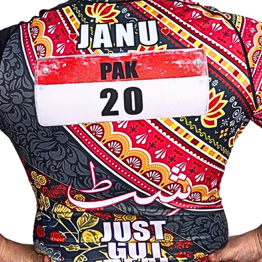 Khokhloma × Truck Art jersey back — JANU, PAK 20, Urdu calligraphy and truck-art slogans fused with Russian Khokhloma florals.